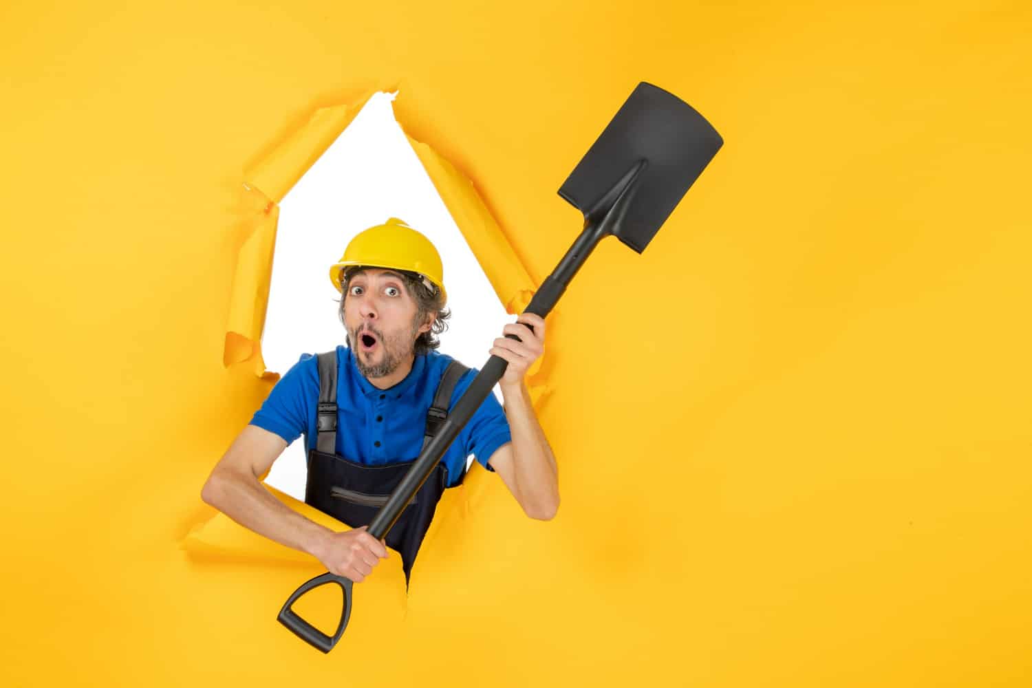 picture of a construction worker holding a shovel
