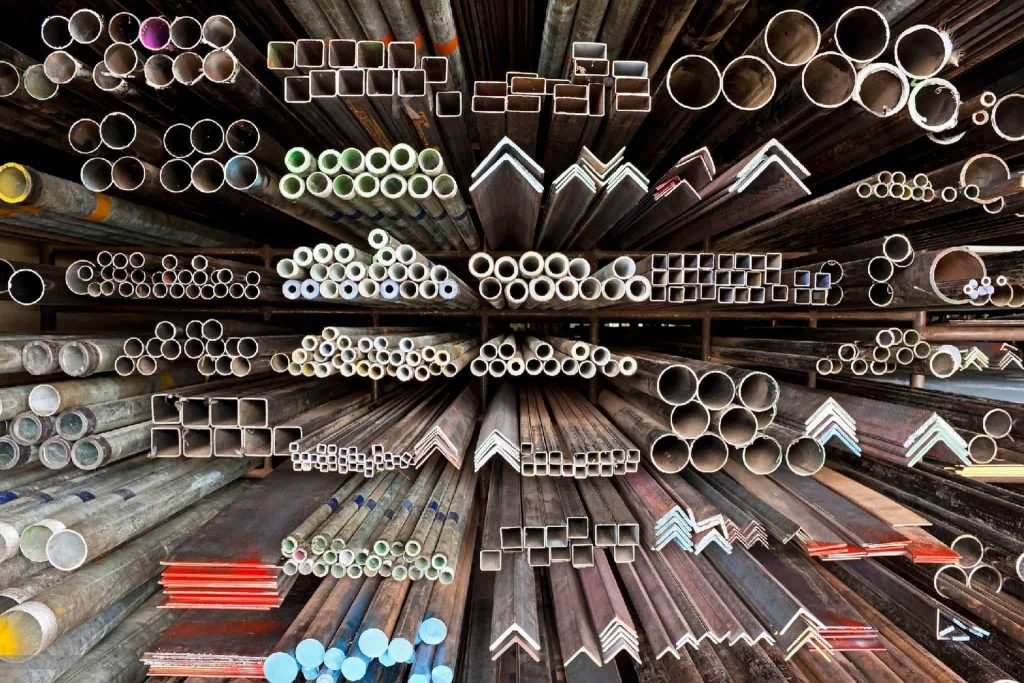 Picture of metal pipes stacked in a warehouse