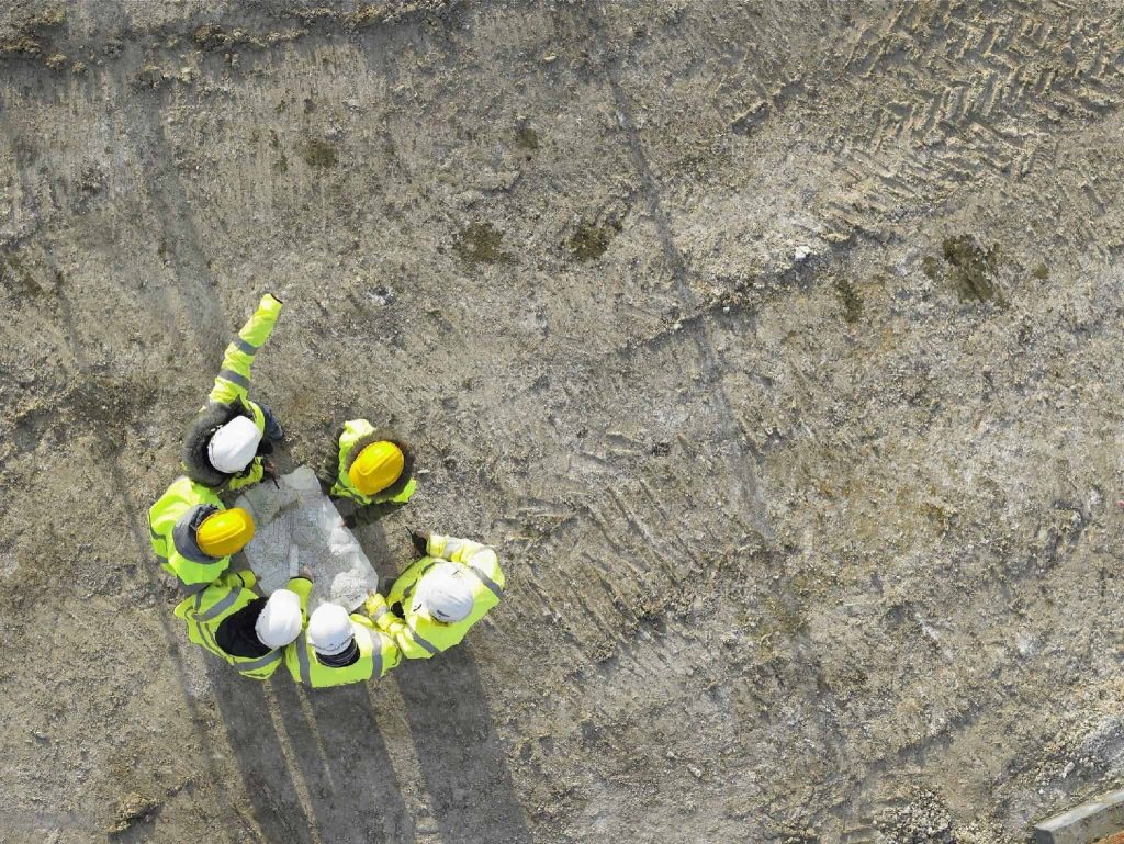 Picture of a construction team discussing plan