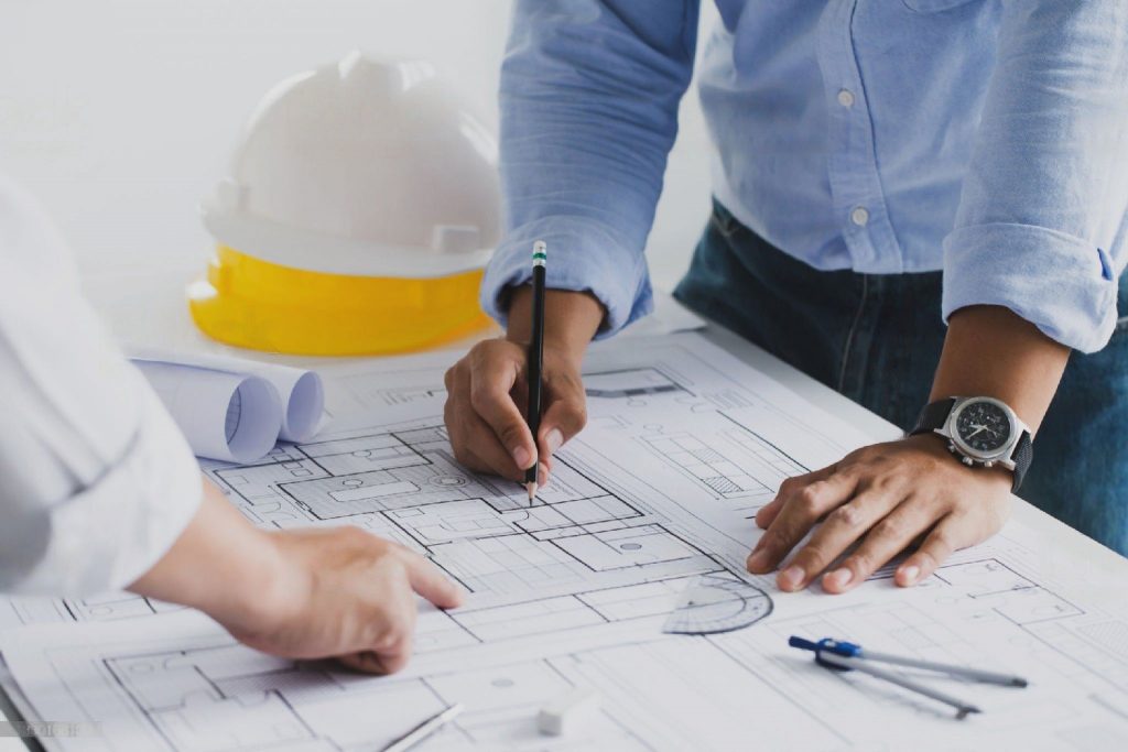 Picture of construction workers working on a building plan